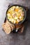 Finnish and Swedish Kottsoppa soup with beef, potatoes, carrots, leeks, celery and parsnip close-up in a plate. Vertical top view