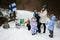 Finnish woman and kids with Finland flags on a nice winter day. Nordic Scandinavian people