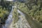 Fiora river green banks and shoal south of Mirafiora bridge, near Pitigliano, Italy