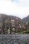 FiordLand National Park. Steep slopes overgrown with greenery along the banks of the fjord. South Island, New Zealand