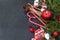Fir branches, candle, cinnamon, twig, cotton candy, fir cones, red balls, Christmas decor on black background