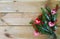 Fir branches with cloth hearts on wood