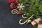 Fir branches, lollipops, cones, gift box, snowflake, a branch of red berries, a slice of dried orange