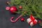 Fir branches, lollipops, gift box with red ribbon, red balls, Christmas