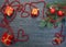 Fir paw, balls, gift, beads, heart on an old, shabby, dark wooden background