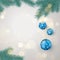 Fir twigs and blue Christmas balls with snowflakes ornament with space for greeting text. Christmas decoration elements.