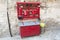 Fire against retro old red axe, shovel, buckets. Fire fighting equipment photo