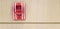 Fire alarm switch box for pull in case of fire isolated on light brown wooden background with right copy space