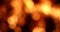 Fire bokeh with bright red and orange circles. Beautiful fire background