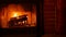 Fire in brick fireplace, firewood burning, wood blazing in cozy lodge or cabin.
