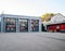 Fire brigade building headquarter with red cars truck behind glass transparent