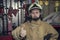 The fire brigade readiness to respond quickly, the fireman in a fireman costume and helmet shows a hand gesture everything is OK