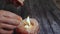 Fire candle scented, close-up of a woman\'s hand with a burning match lighting a candle for fire and lighting.