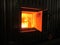 fire the combustion of biomass in the form of pellets in the boiler stoker coal, visible through the open hatch