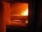 fire the combustion of biomass in the form of pellets in the boiler stoker coal, visible through the open hatch