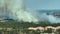 Fire department chopper extinguishing wildfire burning severely in Florida jungle woods. Emergency service helicopter