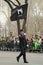 Fire Department of New York firefighter marching with MIA-FDNY flag at the St. Patrick\'s Day Parade