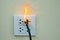 On fire electric wire plug Receptacle and adapter on white background