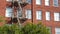 Fire escape ladder outside residential brick building in San Diego city, USA. Typical New York style emergency exit for