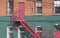 Fire escape and staircase at back of brick building