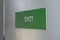 Fire exit white color and green background  sign photo