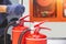 Fire extinguisher has hand engineer inspection checking pressure gauges to prepare fire equipment for protection and prevent in