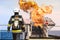 Fire fighter on oil and gas industry, successful firefighter at work , Fire suit for fighter with fire and suit for protect fire