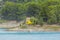 Fire-fighting helicopter collecting water from the Guadalest reservoir