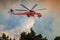 Fire fighting helicopter helicopter drops water on California wildfire