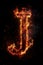 Fire font alphabet J made of burning fire letter on black background