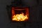 The fire in the furnace. Ember and fire close up. Coals, flames, heat, relax concept background
