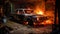 A fire in a garage, a burned car