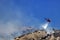 Fire helicopter extinguishes the fire on the hillside . Greece.