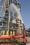 Fire hose spray water on fuel refinery