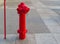 A Fire Hydrant, Waterplug, or Firecock on City Street, Red Steel Pipe, Urban Fire-Fighting Equipment