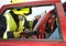 Fire officer cutting away a car roof at car smash