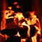 Fire. Photo of flames devouring firewood in a stone fireplace. The texture of the fire in the fireplace. Burning wood inside