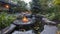 The fire pit is surrounded by a serene water feature combining the elements of fire and water in a tranquil and stunning