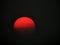 Fire red Sun filtered by forest fire smoke in evening sky