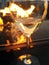 Fire refection in background glass of wine by fireside.