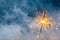 fire sparkler in dense smoke, abstract Christmas firework background