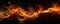Fire and sparks isolated on panoramic black background, banner of abstract burning flame pattern at night. Concept of texture,