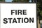 fire station sign writing caption text words in black on white background. p
