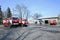 Fire territory station: firetrucks parked at the yard, workshop and hangar for vehicles