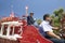 Fire truck and firefighters with dog make their way down main street during a Fourth of July parade in Ojai, CA