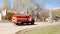 A fire truck rushes through the city streets