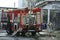 fire truck working, firefighting equipment deployed hoses attached to hydrants, plant facility on a background