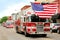 Fire Trucks with American Flags at Small Town Parade