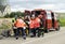 Fire van with firefighters, paramedics and civil guards who are treating and encouraging an injured person in a traffic accident.
