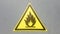 Fire warning icon, sign on a yellow label on a gray background. Flammable. Yellow triangle on a metal wall. Background with copy